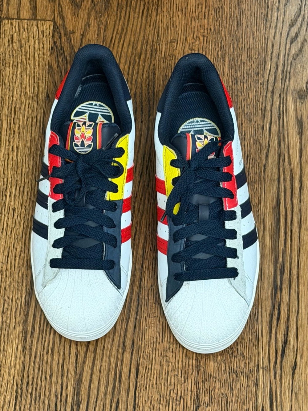 adidas White Sneakers with Black, Red & Yellow Accents